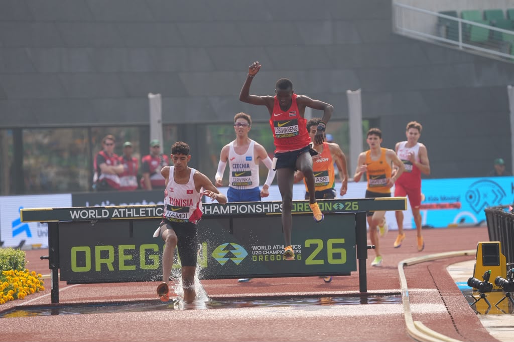 Nicholas Kitum clearing the water jump.